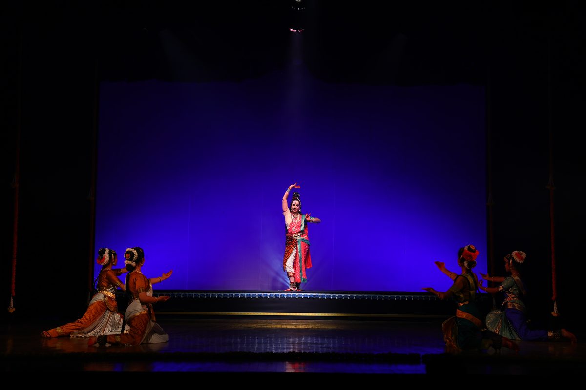 A student performing Bharatanatyam on stage